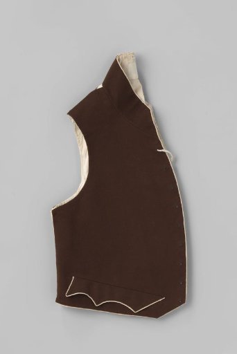 Waistcoat of brown wool trimmed with white silk, diagonally cut front panels, standing collar, pockets with hollow scalloped flaps
