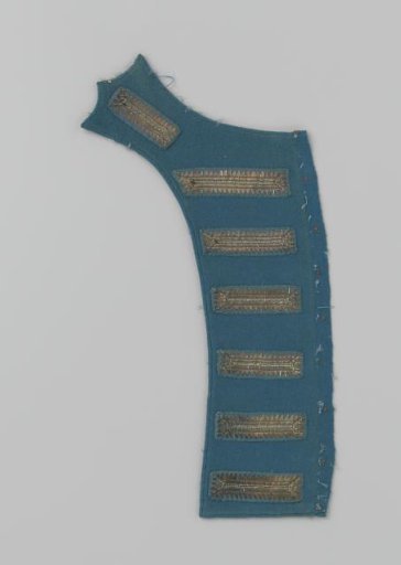 Lapel of blue cloth with seven appliqués of silver embroidery