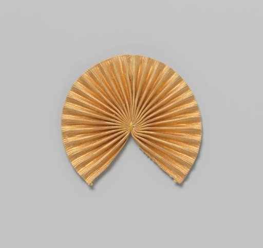Bow of pleated orange ribbon