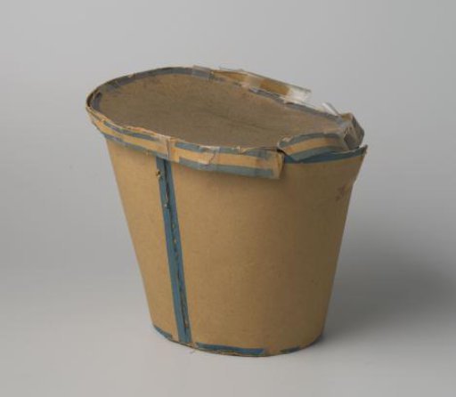 Conical box of cardboard, decorated with blue braid; intended for a shako