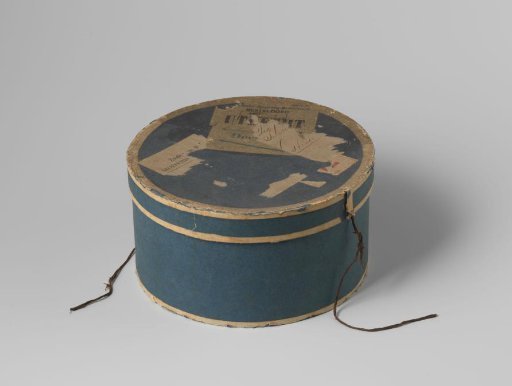 Round box of blue cardboard, covered with white strips