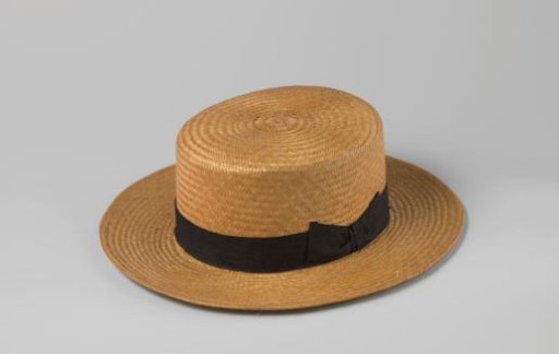 Straw hat with black band tied in a bow