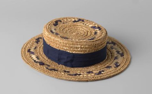 Straw hat of beige, with blue ribbons woven into the straw band