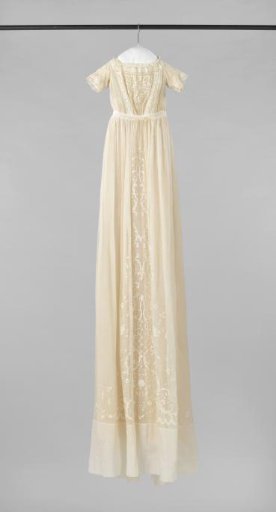 Baptismal gown of batiste with flowers and openwork embroidery and lace.