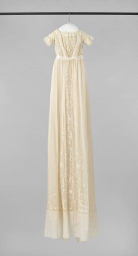 Underdress of cream satin, belonging to baptismal gown of batiste with openwork embroidery.
