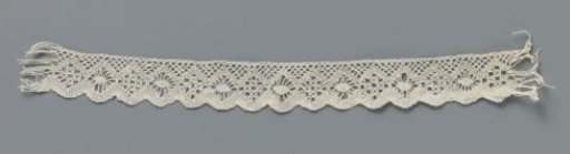 Strip of bobbin lace with diamond pattern and shell border