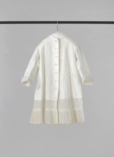 Jacket for a child of cotton damask and decorated with English embroidery.