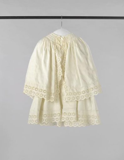 Carriage jacket, for boys and girls, of white cotton damask, with single pelerine and strips of English embroidery