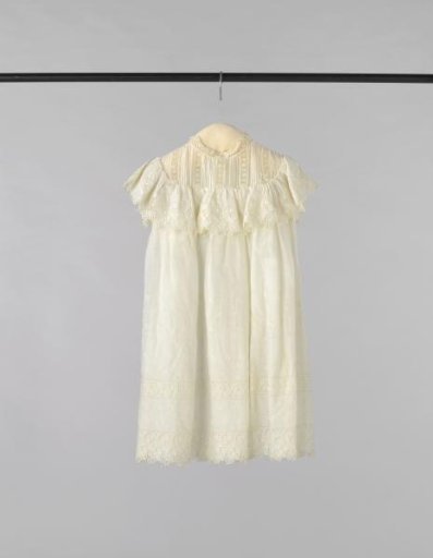 Girl's dress of border fabric with machine-made openwork embroidery