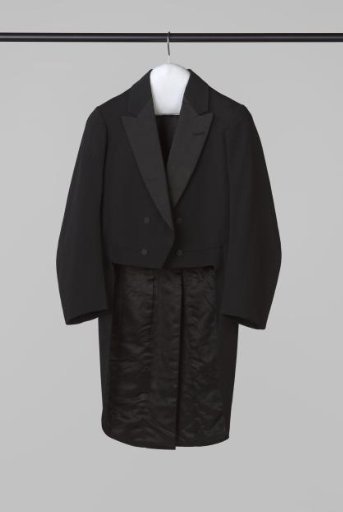 Frock coat of black cloth with black silk collar, two pairs of non-functional black silk buttons, short front panels and batwing-shaped back panels with centre seam, vent and inner pockets