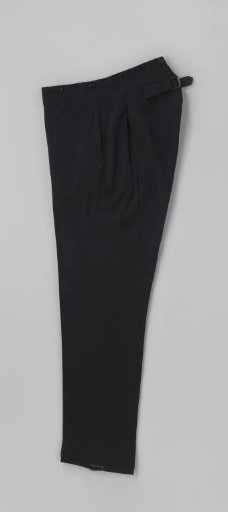Long trousers of black cloth, with narrow tapering legs without turn-ups, side slash pockets with button closure, fly with buttons and six buttons on the waistband