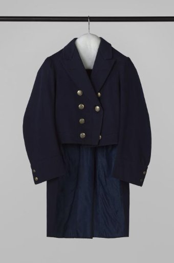 Jacket with short, straight rounded front panels, back panels with a slit, flat collar, short lapels, and buttons with fleur de lys and motto (hora ruit) of blue cloth
