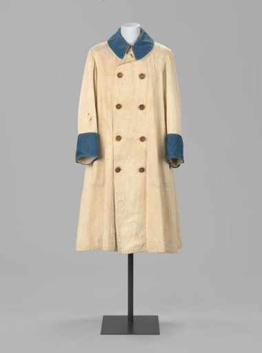Jacket (A) of natural-colored twill cotton, high-closed with a round collar, lapel with double row of horn buttons, deep stitched patch pockets, and a box pleat at the back. With separate, matching collar (B), flap (E), and cuffs (C, D) of indigo-blue cotton