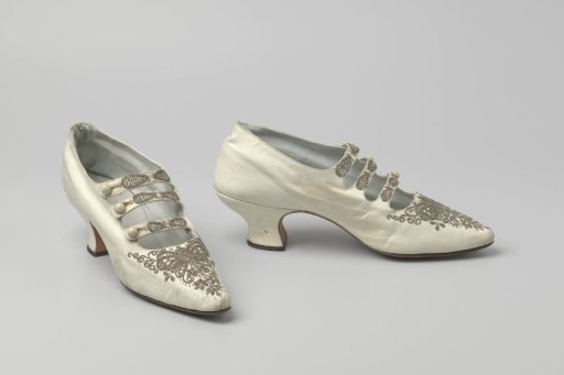 Shoe of white glazed leather with three straps with white round buttons, decorated with white glass beads and pearls