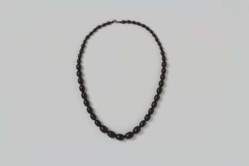 Necklace of black wooden beads, decreasing in size