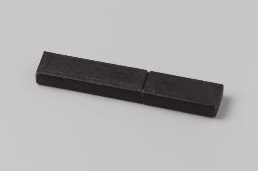 Cardboard case covered with black granulated paper