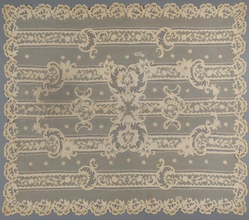 Tablecloth or spread of appliqué lace with stripes and a flowering branch, with old pink lining