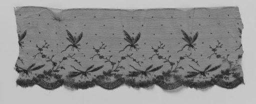 Strip of black machine-made lace with dragonflies