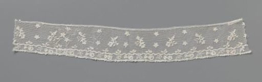Strip of needle lace with floral branches and star-shaped flowers