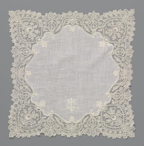 Handkerchief of batiste with an embroidered monogram "ET" and finished around with a border of needle lace