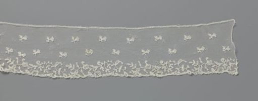 Strip of appliqué lace with bellflowers and wavy flower branches