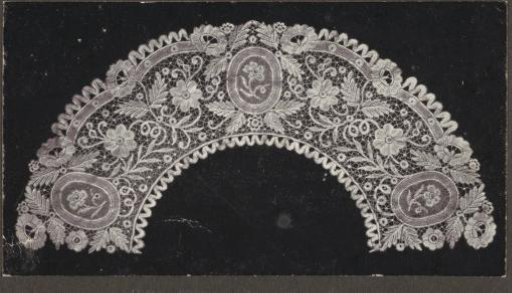 Photograph of a collar or fan leaf of lace with three oval medallions in a floral pattern