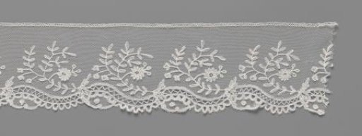 Strip of appliqué lace with C-shaped floral branch