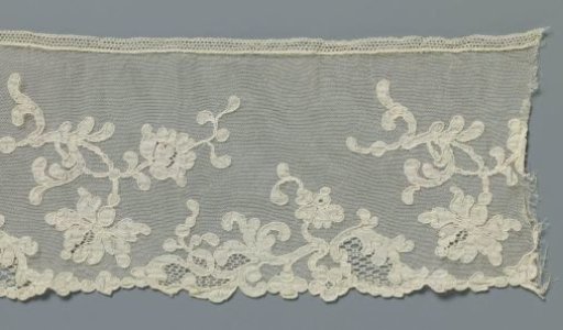 Strip of machine-made lace with crossing branches with carnations