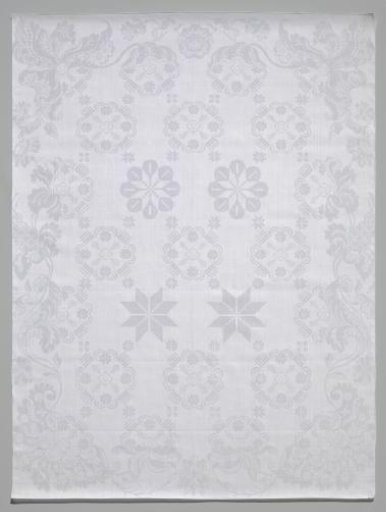 Tablecloth with a pattern of stars and rosettes and a Rococo border