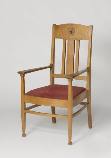 Armchair with a carved woven rosette and upholstered in red/pink moiré