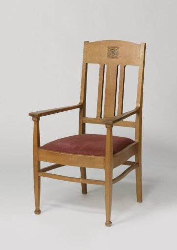 Armchair with a carved woven rosette and upholstered in red/pink moiré