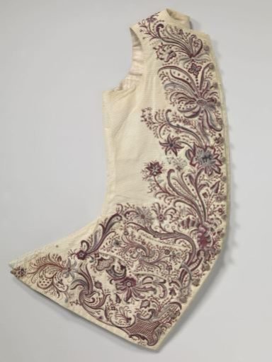 Long Sleeveless Vest of Cream Taffeta, Unadorned at the Back and Almost Entirely Covered on the Front with Large Embroidered Floral and Leaf Motifs in Grey, Bordeaux, White, and Cream