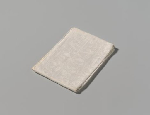 Fragment of a linen damask tablecloth with a floral pattern