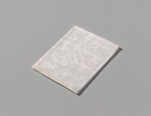 Linen damask napkin with a floral pattern