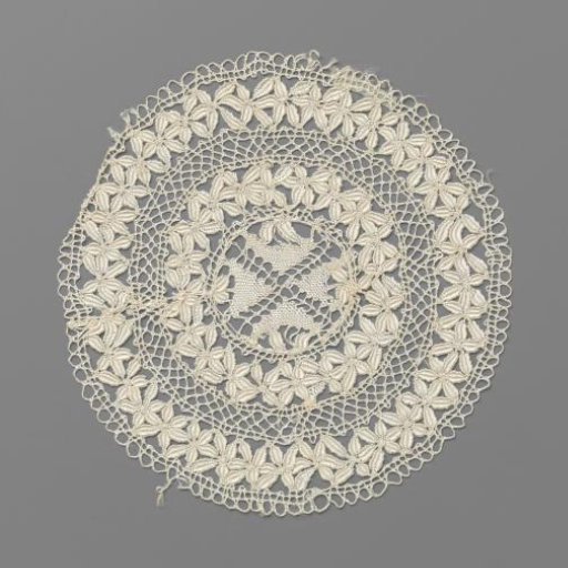 Round bobbin lace doily with Maltese cross surrounded by borders of six-petaled flowers