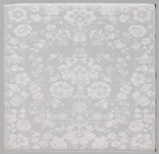 Linen damask napkin with a floral pattern