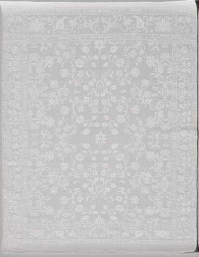 Napkin of linen damask with a floral pattern