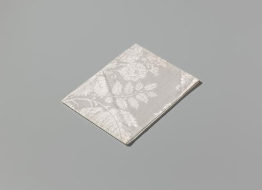 Napkin of linen damask with a lace pattern
