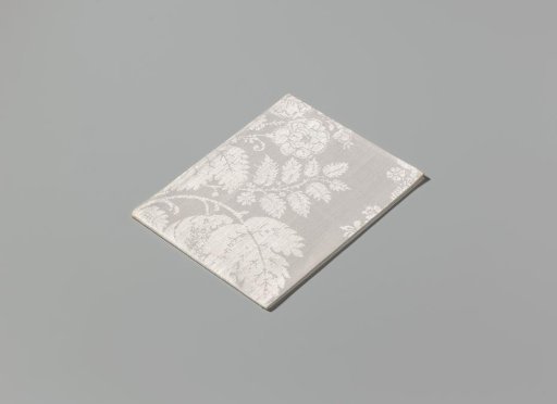 Napkin of linen damask with a lace pattern