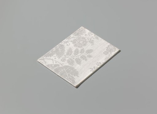 Napkin of linen damask with a lace pattern