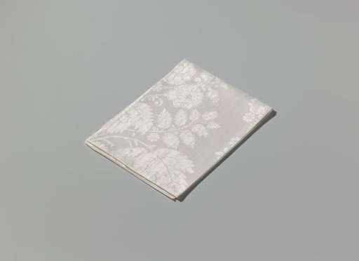 Linen damask napkin with a lace pattern