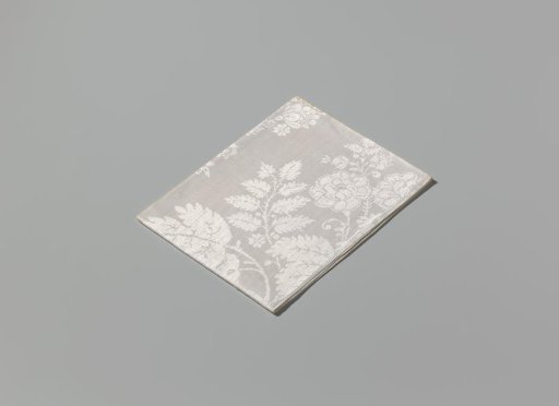 Linen damask napkin with a lace pattern