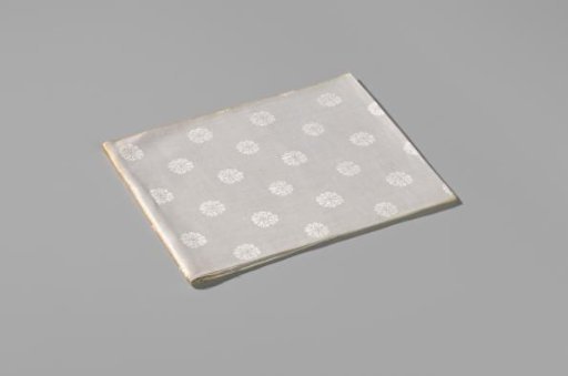 Napkin with pattern of rosettes and rose branches