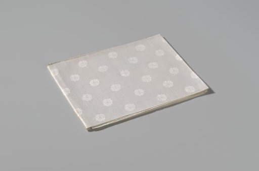 Napkin with pattern of rosettes and rose branches