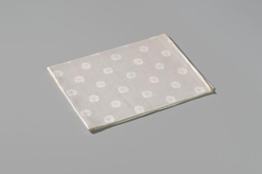 Napkin with pattern of rosettes and rose branches