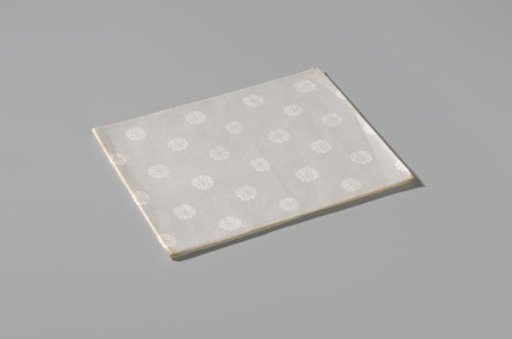 Napkin with pattern of rosettes and rose branches