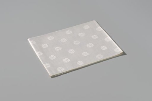 Napkin with a pattern of rosettes and rose branches