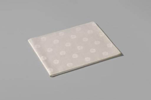Napkin with a pattern of rosettes and rose branches