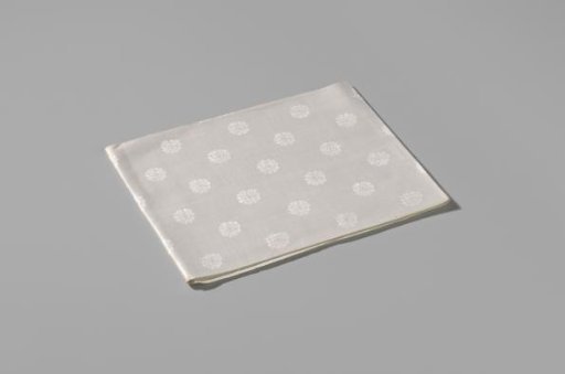 Napkin with a pattern of rosettes and rose branches