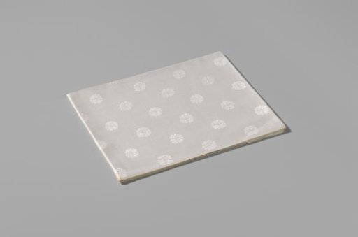 Napkin with a pattern of rosettes and rose branches